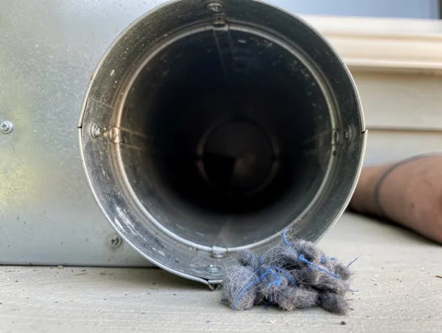 Pataskala Dryer Vent Cleaning technician using specialized equipment to clear severe dryer vent blockage in Pataskala